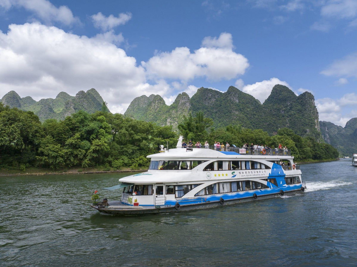 Li River cruise boat among Guilin karst peaks