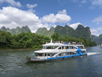 Li River cruise boat among Guilin karst peaks